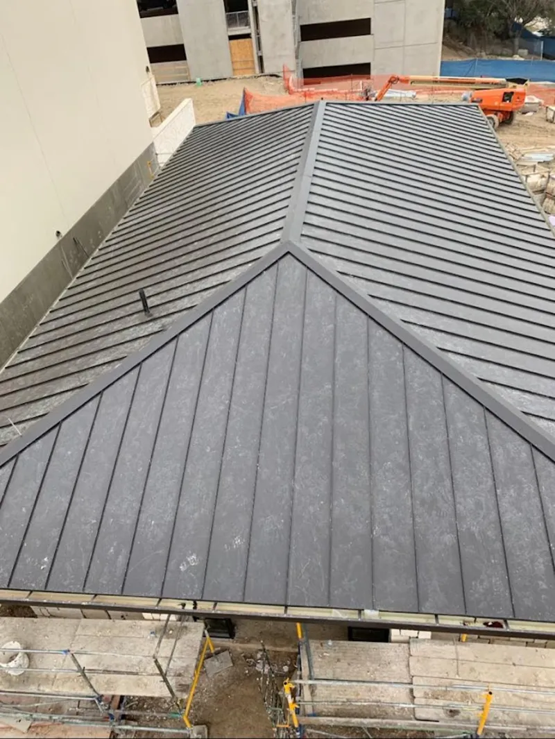 Commercial metal roof construction with crane equipment in Palos Verdes Estates