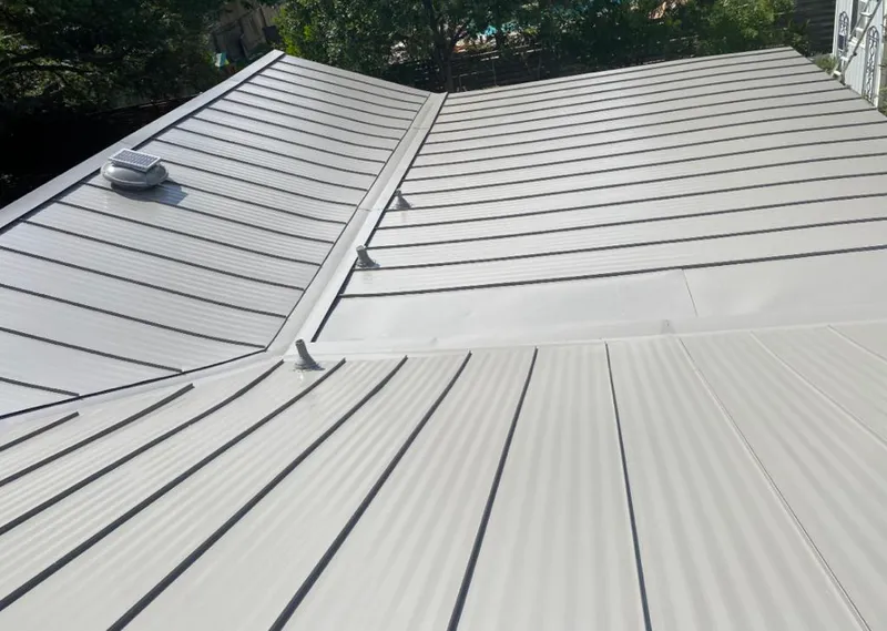 Solar attic fan installed on a metal roof for Roof Ventilation in Palos Verdes Estates